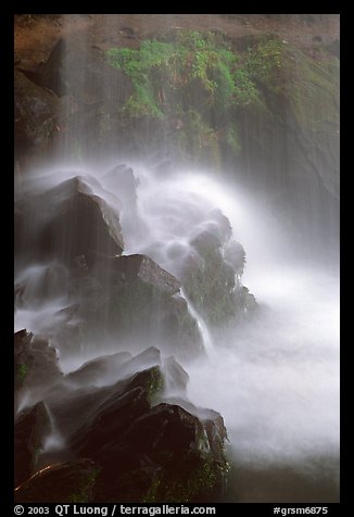 Misty water falling on dark rocks, Grotto falls, Tennessee. Great Smoky Mountains National Park, USA.