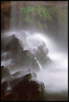 Misty water falling on dark rocks, Grotto falls, Tennessee. Great Smoky Mountains National Park, USA.