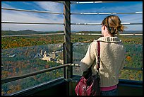 Tourist looking at the view from Hot Springs Mountain Tower in the fall. Hot Springs National Park, Arkansas, USA.