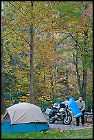 Tent and motorcycle camper under trees in fall colors. Hot Springs National Park, Arkansas, USA.