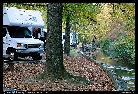 RV, trees in fall colors, and stream. Hot Springs National Park, Arkansas, USA.