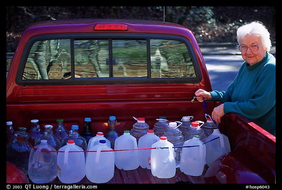 Resident stocks up on natural spring water. Hot Springs National Park, Arkansas, USA.