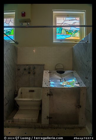 Sitz tub and head-out vapour cabinet below stained glass, Fordyce Bathhouse. Hot Springs National Park (color)