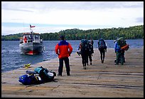 Backpackers waiting for pick-up by the ferry at Windego. Isle Royale National Park, Michigan, USA. (color)