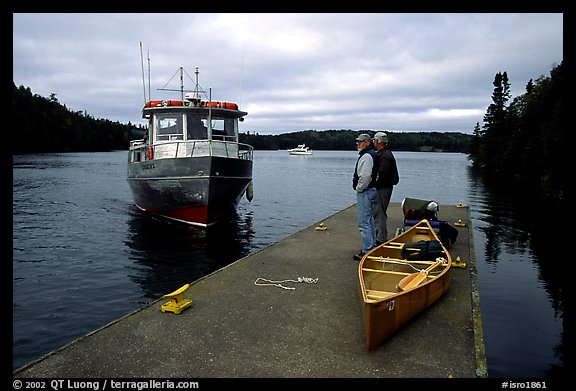 Canoists waiting for pick-up by the ferry at Chippewa harbor. Isle Royale National Park (color)