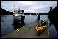 Canoists waiting for pick-up by the ferry at Chippewa harbor. Isle Royale National Park, Michigan, USA. (color)