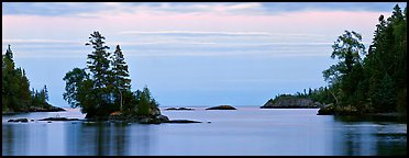 Tree-covered islet at dawn. Isle Royale National Park, Michigan, USA.