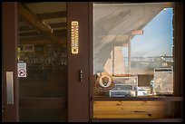 Snug Harbor and store window reflexion, Rock Harbor Visitor Center. Isle Royale National Park ( color)