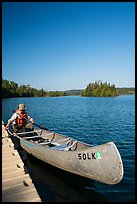 Canoist at dock, Tobin Harbor. Isle Royale National Park ( color)