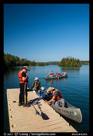 Canoists disembarking, Tobin Harbor. Isle Royale National Park, Michigan, USA.