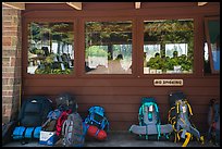 Backpacks lined behind visitor center, Rock Harbor. Isle Royale National Park ( color)