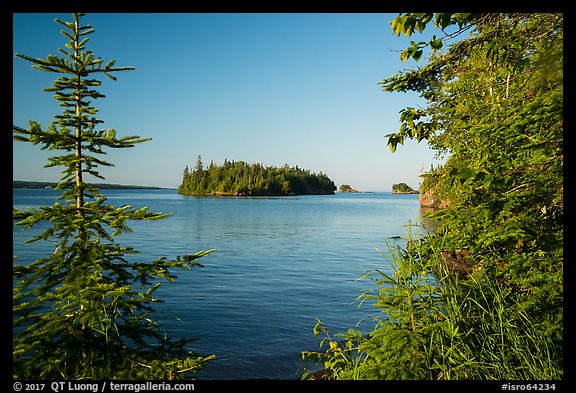 Islands of archipelago framed by trees from Tookers Island. Isle Royale National Park (color)