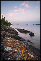 Lichen-colored rocks on Rock Harbor shore, sunset. Isle Royale National Park ( color)
