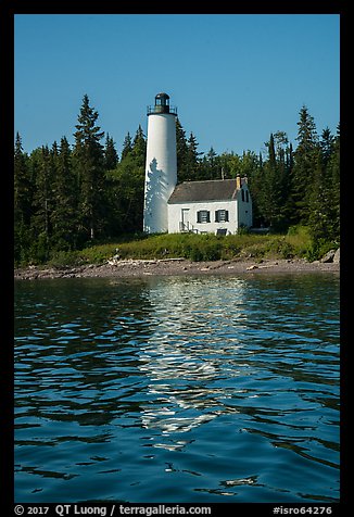 Rock Harbor Lighthouse with tree shadaow and reflection. Isle Royale National Park, Michigan, USA.