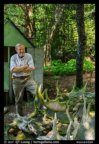 Rolf Peterson and moose skull and antlers collection. Isle Royale National Park (color)