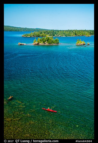 Kayakers, blue waters, and islets from above. Isle Royale National Park, Michigan, USA.