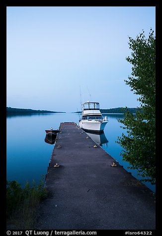 Motorboat and yacht moored at Moskey Basin dock. Isle Royale National Park, Michigan, USA.