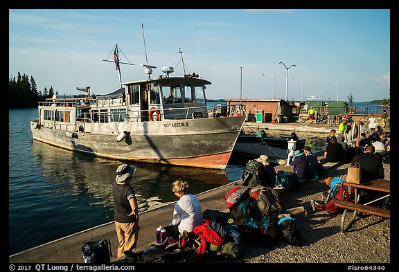 Backpackers wait to board ferry at Rock Harbor. Isle Royale National Park, Michigan, USA.