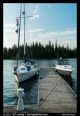 Sailboat and motorboat moored at Rock Harbor. Isle Royale National Park (color)