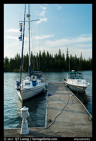 Sailboat and motorboat moored at Rock Harbor. Isle Royale National Park, Michigan, USA.