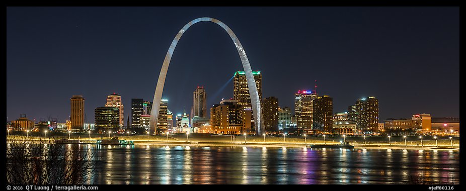 St Louis skyline across Mississippi River at night. Gateway Arch National Park, St Louis, Missouri, USA.