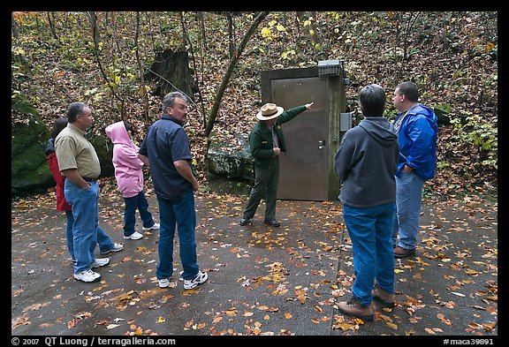 Ranger pointing to cave entrance to tourists. Mammoth Cave National Park (color)