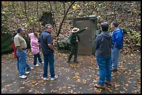 Ranger pointing to cave entrance to tourists. Mammoth Cave National Park, Kentucky, USA. (color)