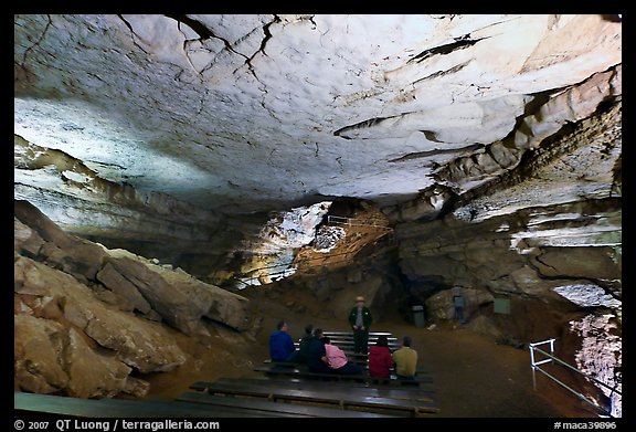 Tourists listening at ranger in large room inside cave. Mammoth Cave National Park (color)