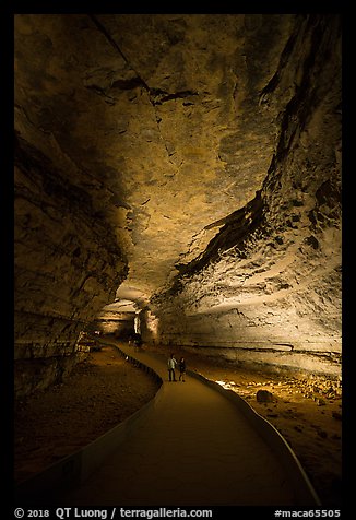 Visitors walk down path in cave. Mammoth Cave National Park (color)