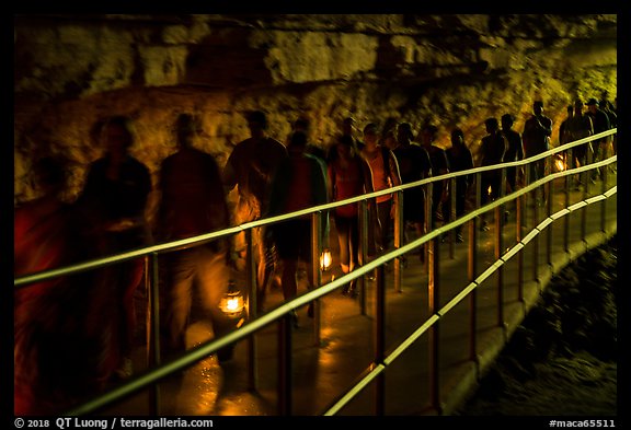 Motion blurred visitors holding lanterns. Mammoth Cave National Park, Kentucky, USA.