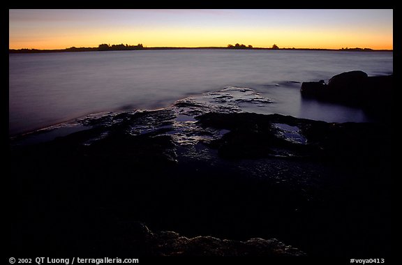 Slabs and distant trees at sunrise, Kabetogama lake near Woodenfrog. Voyageurs National Park (color)