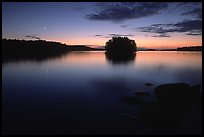 Sunset with moon and island on Kabetogama Lake near Ash river. Voyageurs National Park, Minnesota, USA.