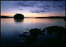 Kabetogama lake sunset with eroded granite and tree-covered islet. Voyageurs National Park, Minnesota, USA.