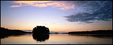 North woods tree-overed isled at sunset. Voyageurs National Park (Panoramic color)