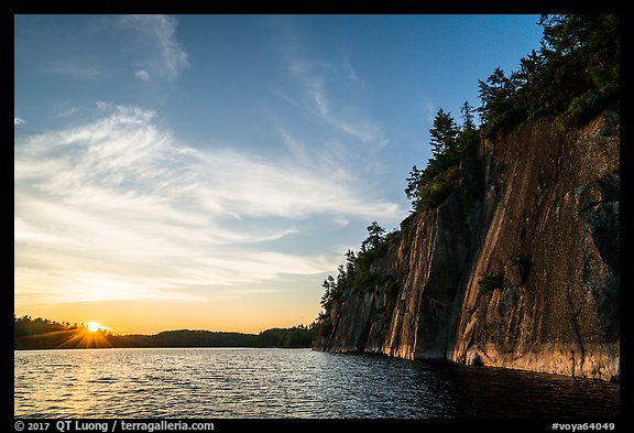 Sun setting and Grassy Bay Cliffs at sunset. Voyageurs National Park (color)