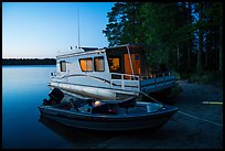 Motorboat and houseboat at dusk, Houseboat Island. Voyageurs National Park ( color)