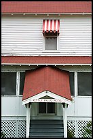 Kettle Falls Hotel door and window with red and white stripes awning. Voyageurs National Park ( color)