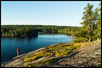 Visitor looking, Anderson Bay. Voyageurs National Park ( color)