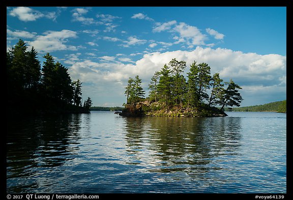 North Woods islet and reflection, Sand Point Lake. Voyageurs National Park, Minnesota, USA.