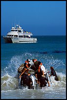 Skiff crossing  surf to join tour boat, Cuyler harbor, San Miguel Island. Channel Islands National Park, California, USA.