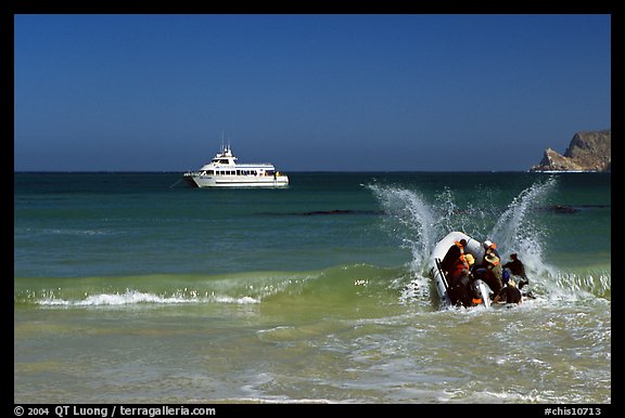 Skiff going back to main boat through surf, Cuyler harbor, San Miguel Island. Channel Islands National Park, California, USA.