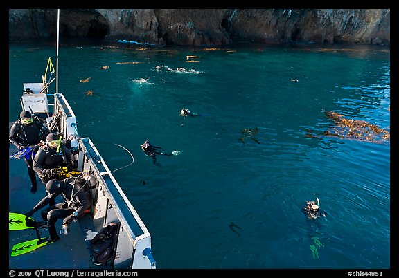 Diving boat and scuba divers in water, Annacapa. Channel Islands National Park, California, USA.