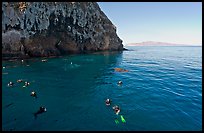 Divers, emerald waters, and steep cliffs, Annacapa island. Channel Islands National Park, California, USA.