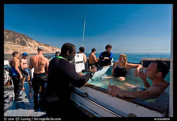 Divers in hot tub aboard the Spectre dive boat, Santa Cruz Island. Channel Islands National Park, California, USA.