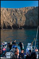 Dive boat and cliffs, Annacapa Island. Channel Islands National Park, California, USA.