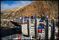 Unloading via human chain, Scorpion Anchorage, Santa Cruz Island. Channel Islands National Park ( color)