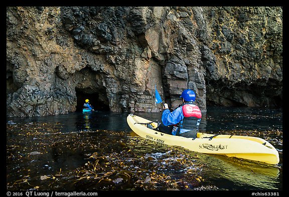 Kayakers entering sea cave, Santa Cruz Island. Channel Islands National Park (color)