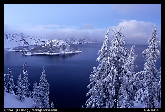 Wizard Island and Lake at dusk in winter. Crater Lake National Park, Oregon, USA.