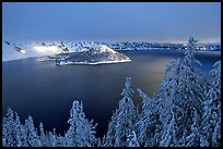 Trees, Lake and Wizard Island, winter sunrise. Crater Lake National Park, Oregon, USA.