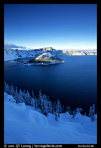 Wizard Island and lake in winter, late afternoon. Crater Lake National Park, Oregon, USA.